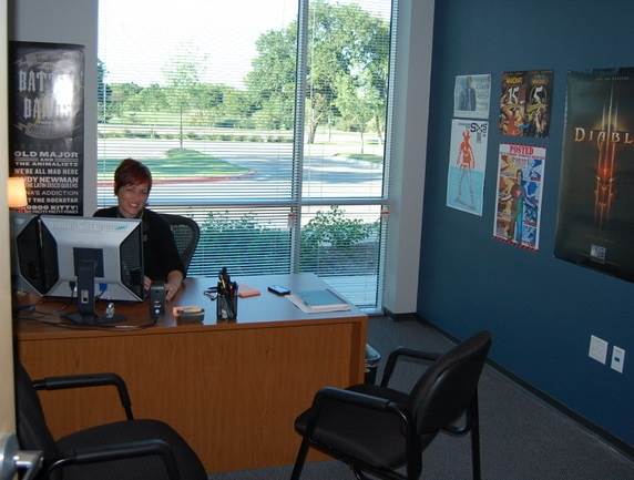 alum Anita Rice at her desk at Blizzard Entertainment